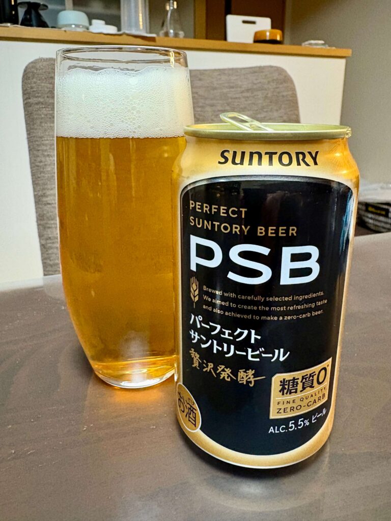 A glass of freshly poured Perfect Suntory Beer, next to PSB can