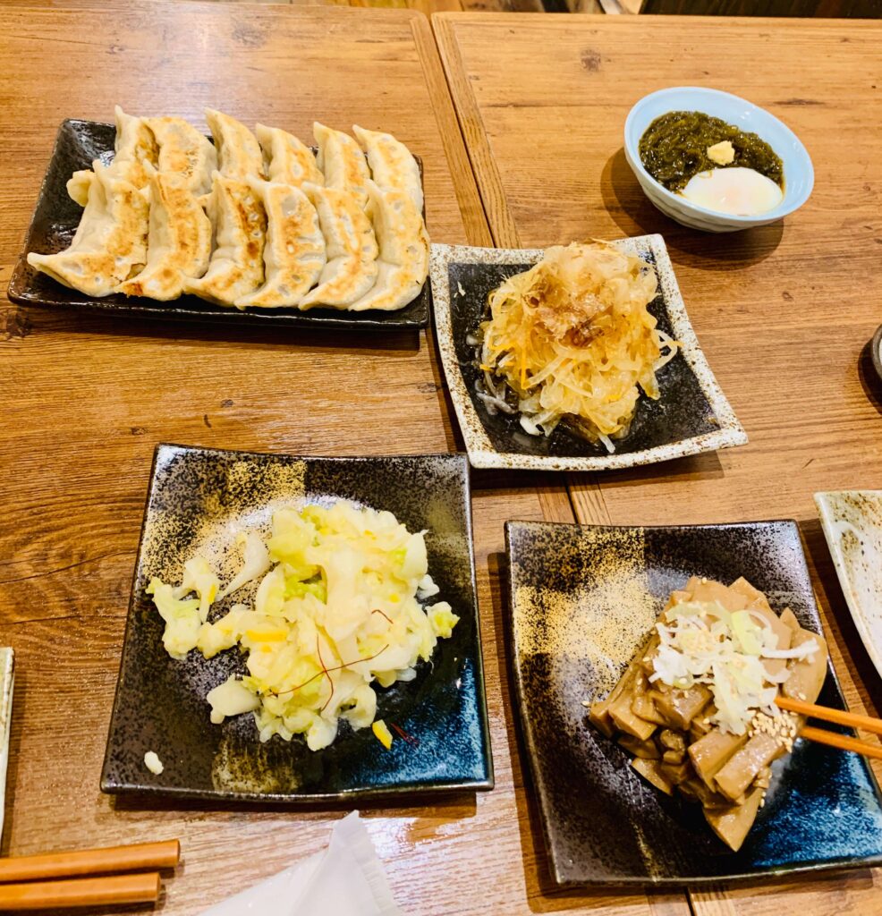 Gyoza and a few side dishes at an Izakaya in Tokyo