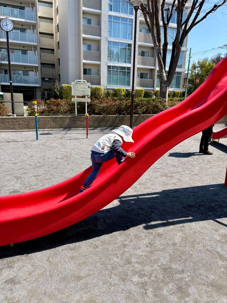 My son playing in a local park on a beautiful sunny March day.