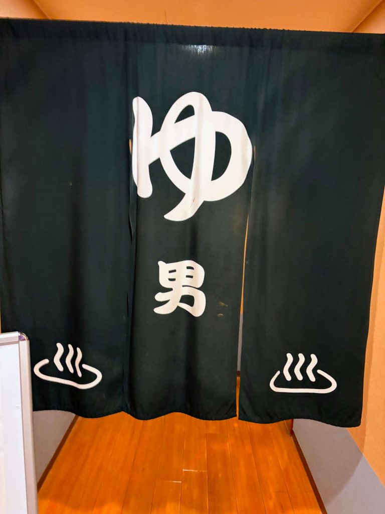 Dark navy blue curtain for men at an onsen